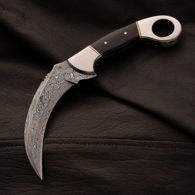 full tang Damascus blade on karambit curved knife with steel bolsters and horn scales