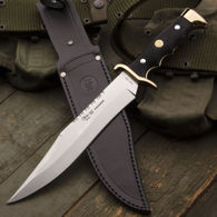 Spanish military-style combat/field knife with full tang clip point blade, jimped spine, black ABS handles with finger grooves