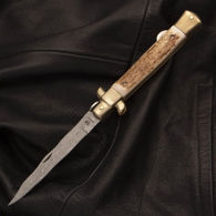 Hen and Rooster stiletto pocket knife with the Kris pattern Damascus steel blade and stag scales