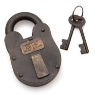 massive steel lock is fully functional with a badge “Property Of New York Insane Asylum” includes 2 keys similarly antiqued