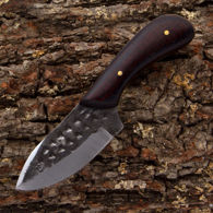 Blacksmith Stubby Custom Skinner has full profile tang with hammer marked carbon steel blade, micarta scales, leather sheath