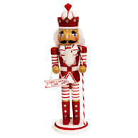 Candy Cane King Nutcracker is red and white, his staff is a candy cane, he holds a sign that points to where treasure is