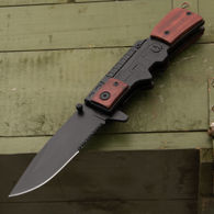 folding knife with AK47 style wood handle, blackened stainless steel blade, one hand opening with "trigger" integral thump flipper 