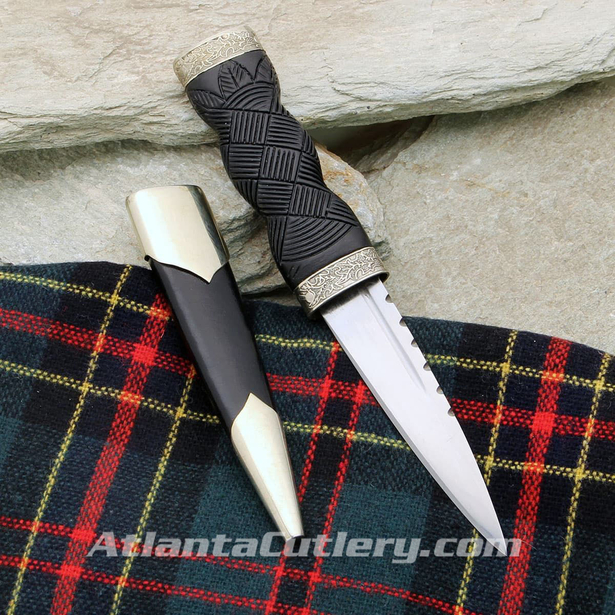 Windlass Sgian Dubh has sharp high carbon steel blade, black wood handle and embossed nickel silver fittings with thistle motif
