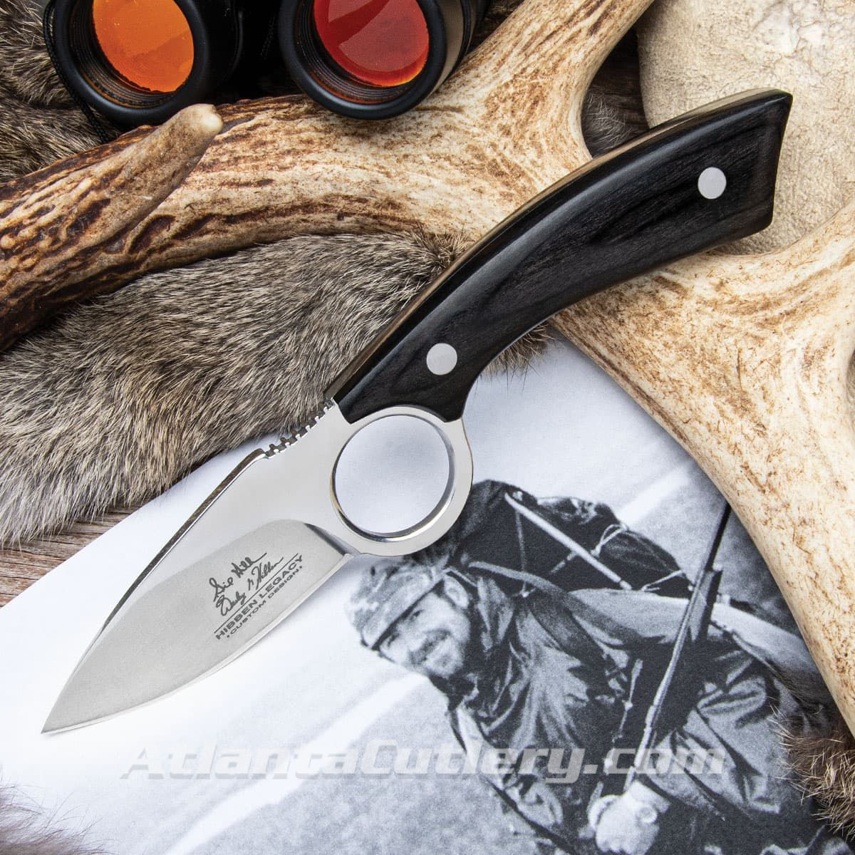 Hibben Legacy Skinning Knife has 5Cr15 stainless steel blade with a finger ring, pakkawood scales and includes leather sheath