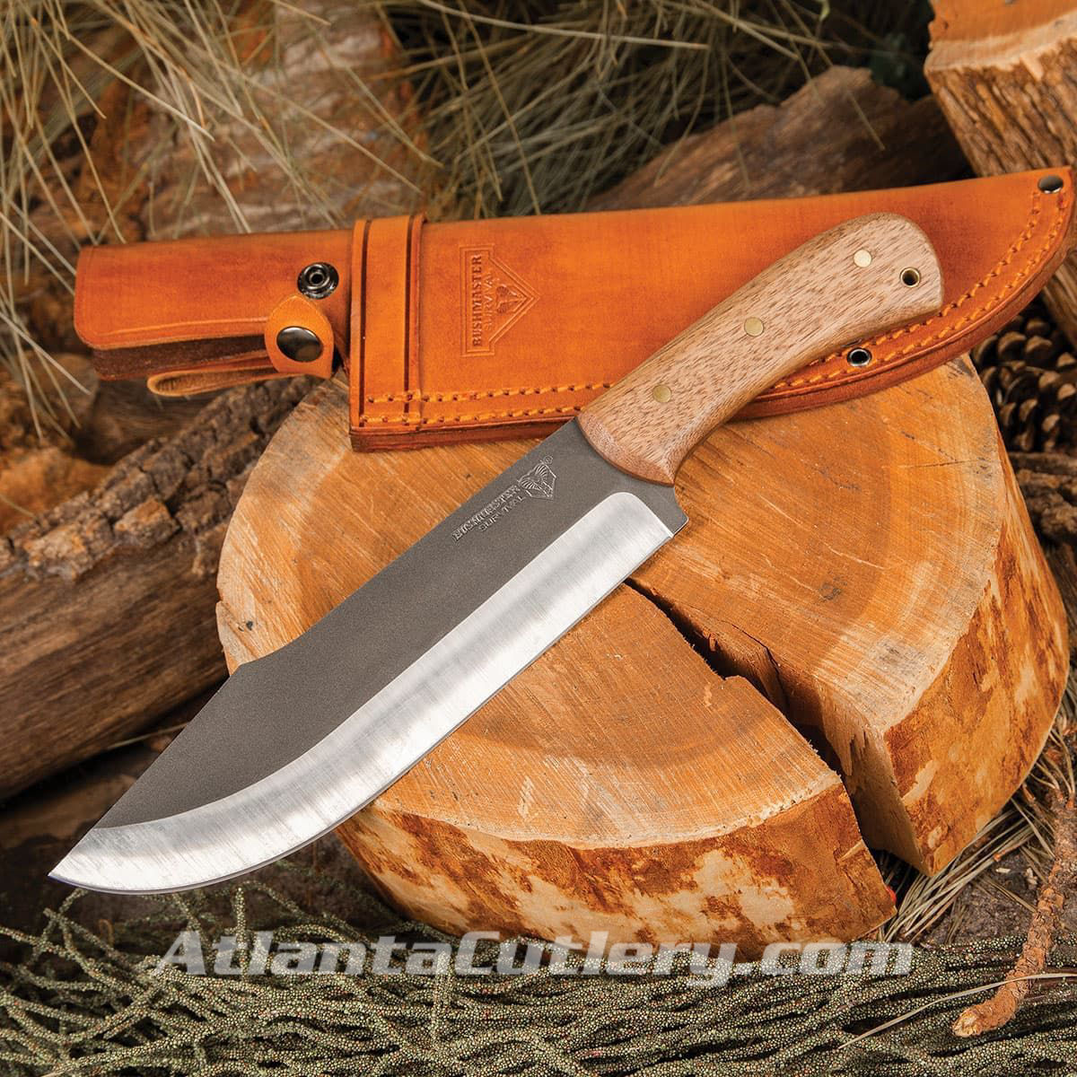 Bushmaster Butcher Bowie Knife has sharp full-tang, clip point blade, hardwood scales, brass pins, lanyard hole, leather sheath