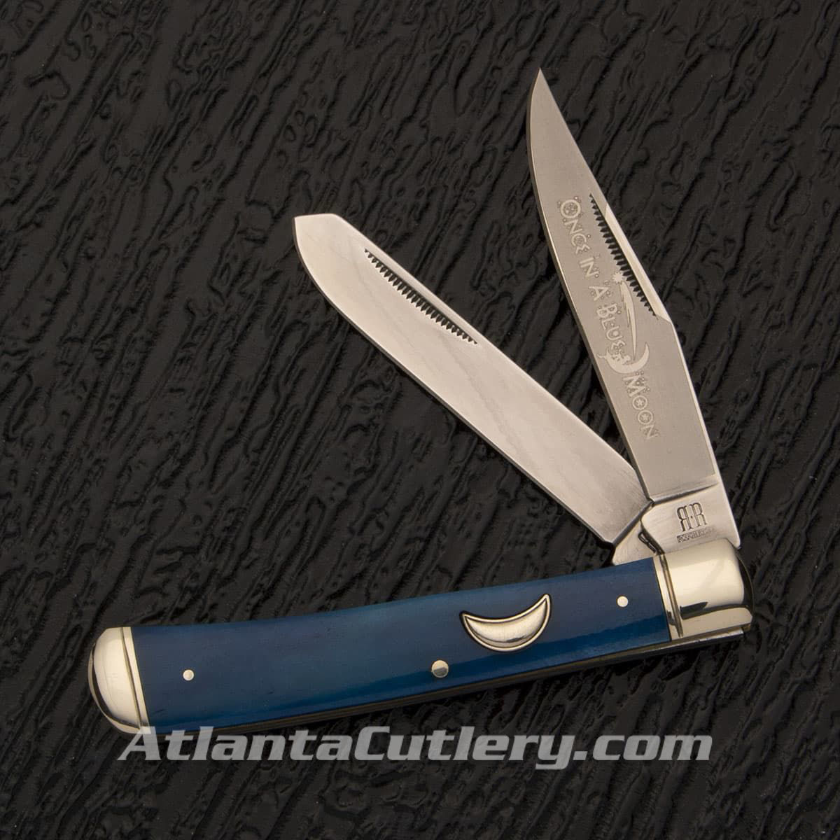 Rough Ryder Once in a Blue Moon Trapper pocket knife with bone handle dyed deep blue with a crescent moon shield