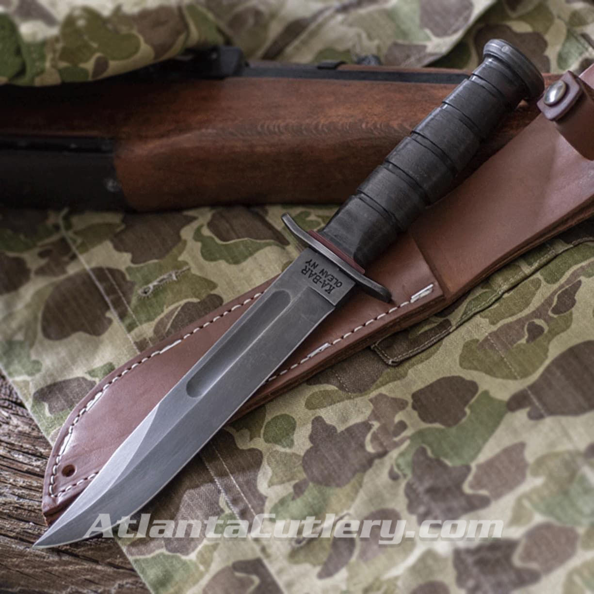 replica WWII KA-BAR Red Spacer Fighting Knife with 1095 cro-van steel blade, hand-shaped and dyed leather spacers, aged sheath