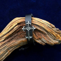 Comfortable leather cuff bracelet with adjustable cord and silver metal cross
