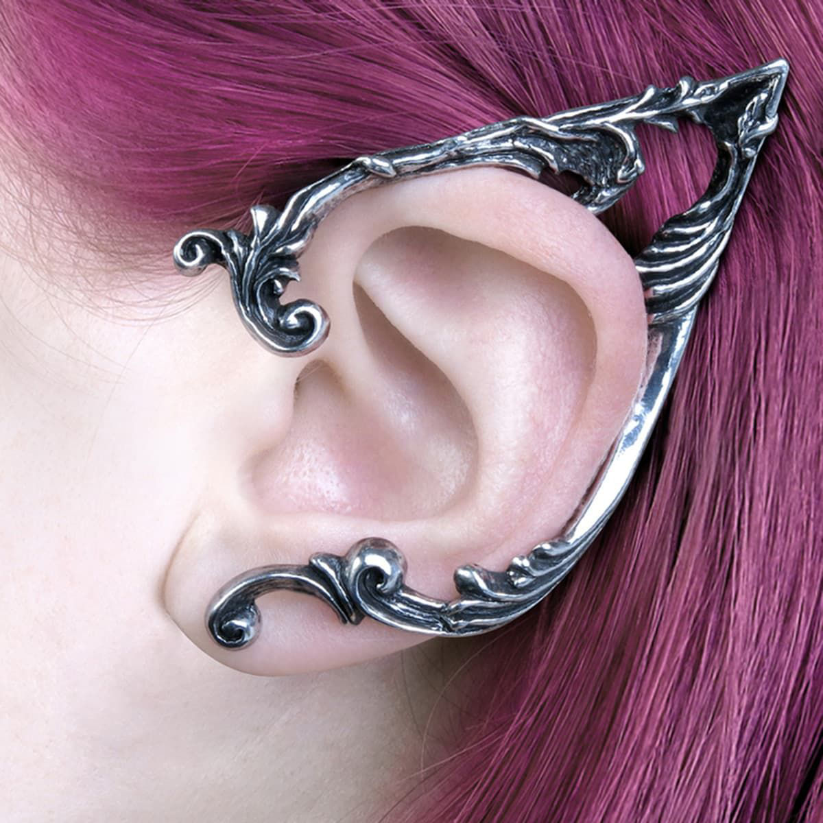 polished, antiqued pewter pointed elf ear-shaped ear wrap with floral scrollwork frames the left ear and fastens at the lobe 