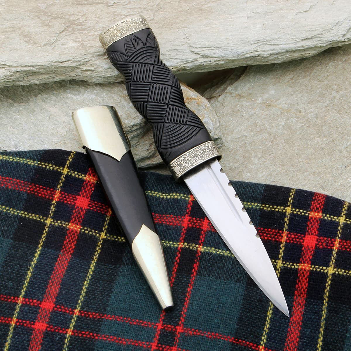 Windlass Sgian Dubh has sharp high carbon steel blade, black wood handle and embossed nickel silver fittings with thistle motif