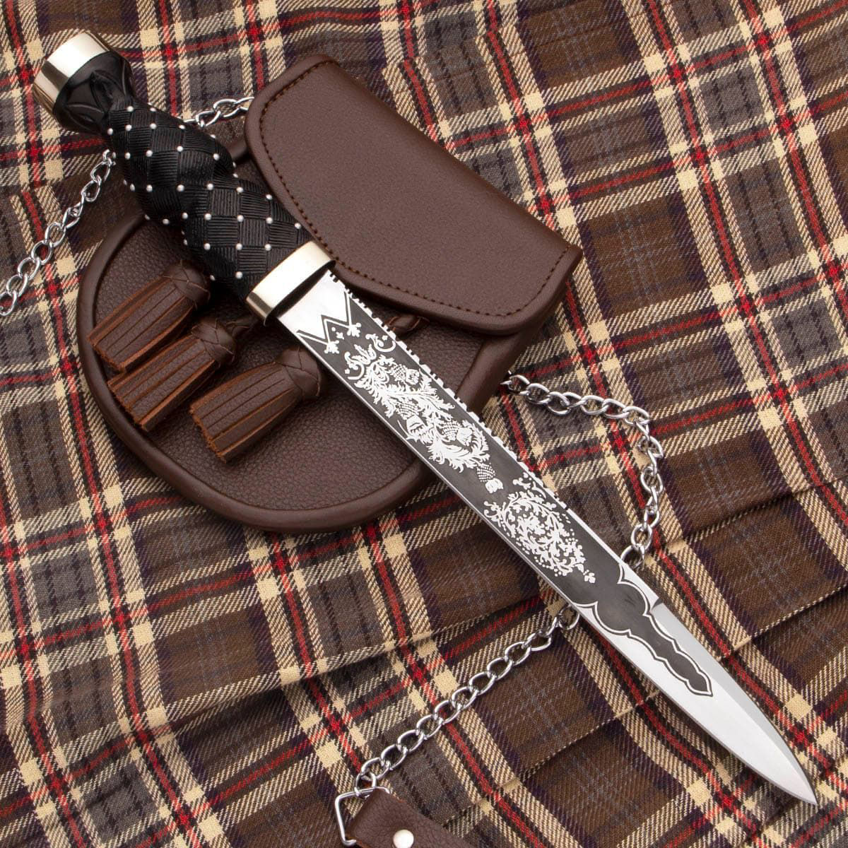 Scottish dirk has sharp 1055 high carbon steel blade etched on both sides with foliage and thistle motif, includes leather sheath