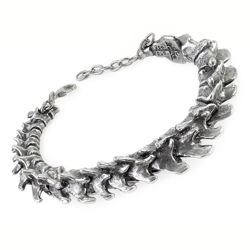 Alchemy solid pewter Vertebrae bracelet is metalized spine of a conquered predator in hinged bangle bracelet with safety chain
