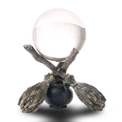 Witchcraft Crystal Gazing Ball rests atop a trio of broomsticks and a cauldron, finely detailed cold cast resin base