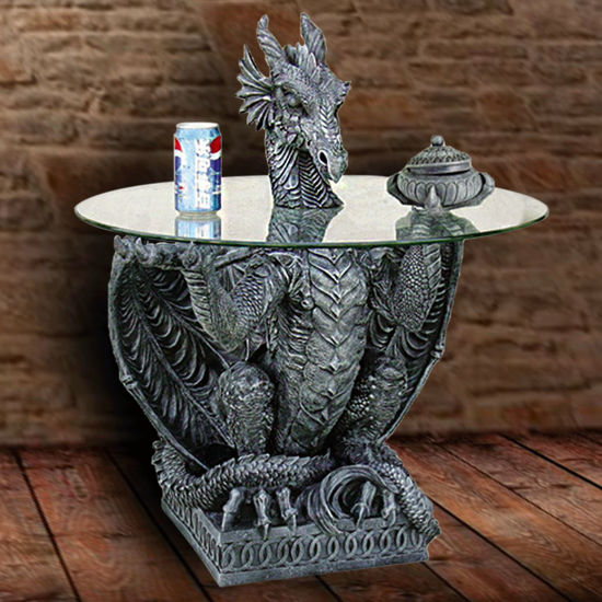 Hand-painted cast resin dragon table looks as though he has come through the glass top