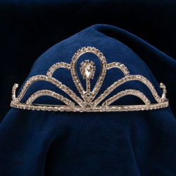 stunning tiara with over a hundred sparkling crystals on a silver metal band. Side combs provide a secure fit
