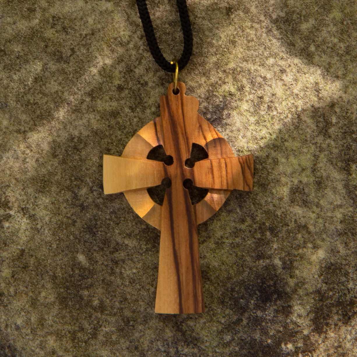 olive wood Celtic cross pendant handcrafted in Bethlehem using pruned limbs, then dried and carved to show the wood grain