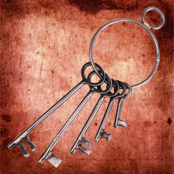 set of 5 iron keys in various styles ranging from 2-1/4" long to 6" on a large 3-1/2" steel ring