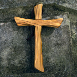 large olive wood cross handcrafted in Bethlehem using pruned limbs, then dried and carved to show the wood grain