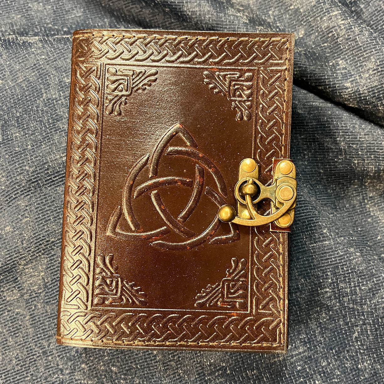 Trinity Knot Leather Journal bound with 120 pages of handmade parchment paper and working antiqued brass latch for closure