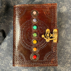 Chakra Stone Leather Journal bound with 180 pages of handmade parchment paper and semi precious stones along the front