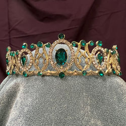 Emerald Princess Tiara has dozens of rhinestones and faux emerald gems on an antiqued gold metal frame