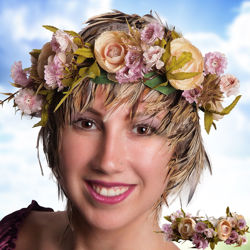 rose flower crown to adorn your hair has peach and lavender colored roses and flowers, ties with a pale yellow ribbon