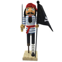 wood Peg Leg Pirate Nutcracker holds a jolly roger flag and cutlass. Wearing a cloth bandana and sash, faux fur hair and beard