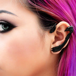 blackened pewter ear wrap with raven head and wings wrapping around the left ear, secures with steel post at the bottom