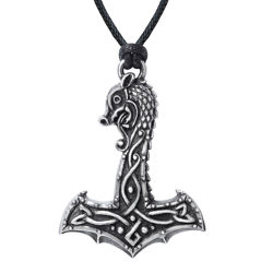antiqued pewter Viking hammer is ornately carved with Celtic knotwork and a dragon's head, hanging from a black waxed cord 